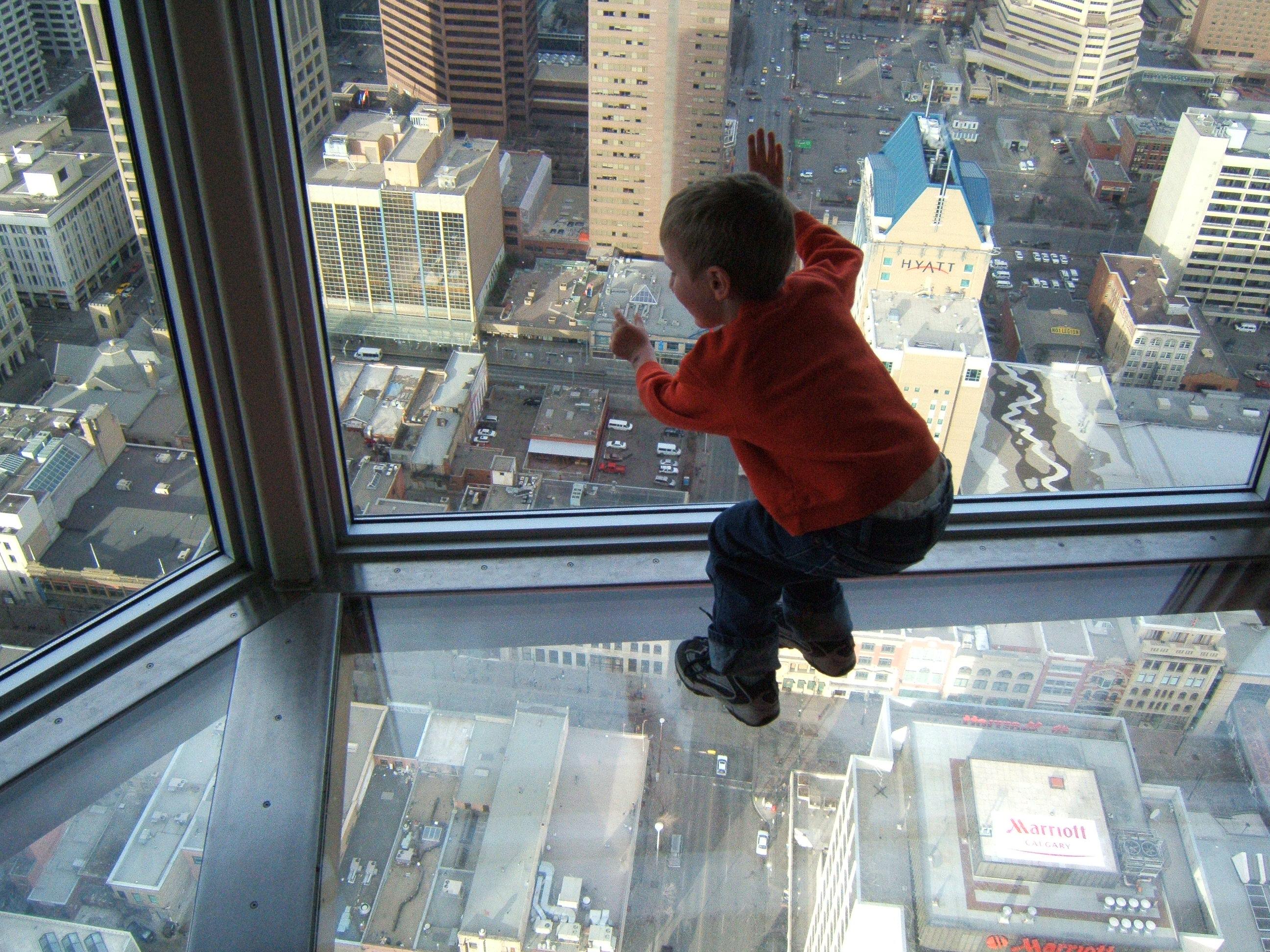 A leaning child's view through a skyscraper's window and glass floor by D'Arcy Norman from Calgary, Canada License under CC BY 2.0 https://en.wikipedia.org/wiki/File:A_leaning_child's_view_through_a_skyscraper's_window_and_glass_floor.jpg#/media/File:A_leaning_child%27s_view_through_a_skyscraper%27s_window_and_glass_floor.jpg ” A leaning child's view through a skyscraper's window and glass floor “ by D'Arcy Norman from Calgary, Canada License under CC BY 2.0 https://en.wikipedia.org/wiki/File:A_leaning_child's_view_through_a_skyscraper's_window_and_glass_floor.jpg#/media/File:A_leaning_child%27s_view_through_a_skyscraper%27s_window_and_glass_floor.jpg