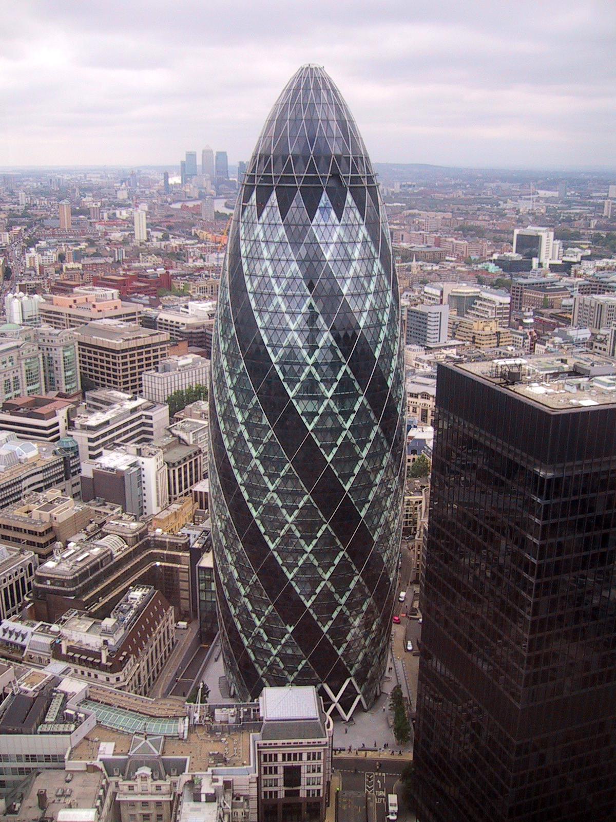 the London Ghurkin - 30 St Mary Axe, Gherkin. By Paste at Wikipedia Licensed under Public domain https://en.wikipedia.org/wiki/File:30_St_Mary_Axe,_'Gherkin'.JPG#/media/File:30_St_Mary_Axe,_%27Gherkin%27.JPG